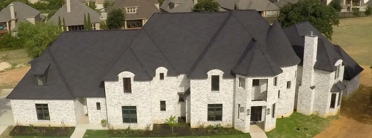 Home with a new roof installed by A Star Roofing of Texas