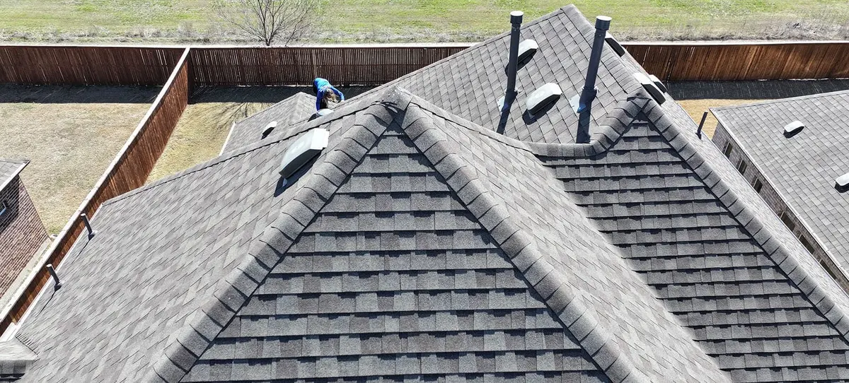 A Star Roofing of Texas crew on a Tarrant County roof